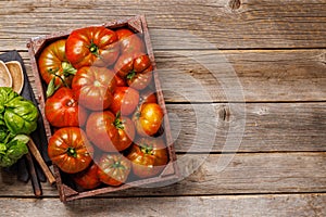 Assorted tomatoes in rustic crate