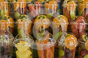 Assorted tropical fruit cups, close up