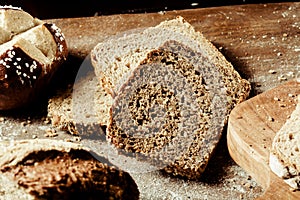 Assorted types of bread on a wooden board