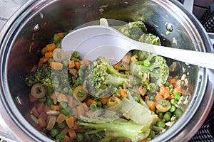Assorted vegetables being cooked in the pan