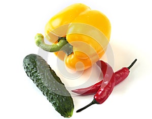 Assorted vegetables, fresh bell pepper, tomato, chilli pepper, cucumber and lettuce on white background