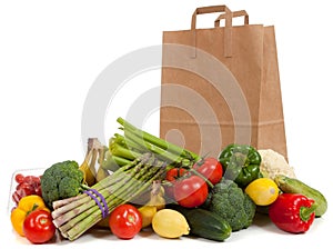 Assorted vegetables with a grocery sack photo