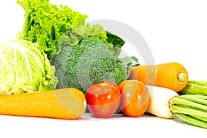 Assorted vegetables radish tomato, carrot, chinese cabbage, broccoli, bitter gourd, chinese kale on a white background