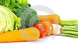 Assorted vegetables radish tomato, carrot, chinese cabbage, broccoli, bitter gourd, chinese kale on a white background