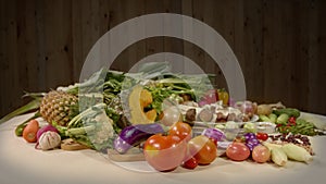 Assorted vegetables, spices and mushrooms are prepared for cooking.