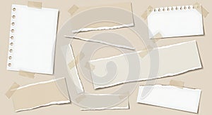 Torn Paper Pieces with Tape on Beige Background