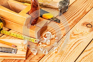 Assorted work tools on wood. Copy space