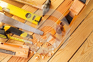 Assorted work tools on wood. Copy space