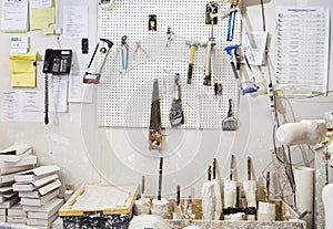 Assorted workshop tools on a pegboard