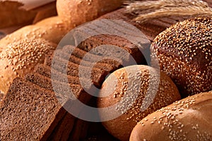 Assortement of Freshly baked traditional bread with ears of wheat