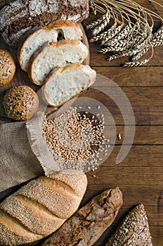 Assortment bread products on wooden table