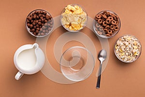 Various careals for breakfast in glass bowls, top view photo