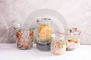 Assortment of cereals and nuts in storage jars