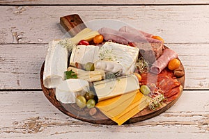 Assortment of cheese and cold meats photo