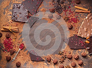 Assortment of chocolate bars, truffles, spices and cocoa powder