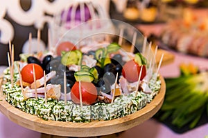 An assortment of colored appetizers and antipasti snacks