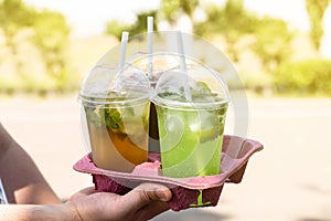 Assortment of Colored Berry Take Away Beverages in plastic cup