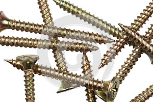 Assortment of copper and aluminum screws isolated, white background