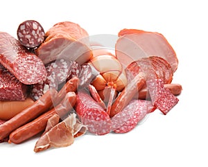 Assortment of delicious deli meats on white background