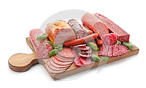 Assortment of delicious deli meats on wooden board, isolated on white photo
