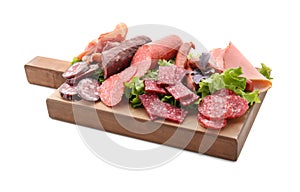 Assortment of delicious deli meats on wooden board, isolated on white
