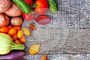 Assortment different fresh organic vegetables on country style wooden background