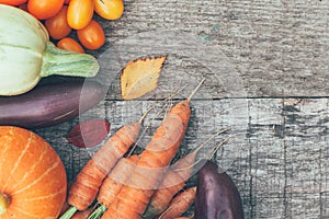 Assortment different fresh organic vegetables on country style wooden background. Healthy food vegan vegetarian dieting concept.