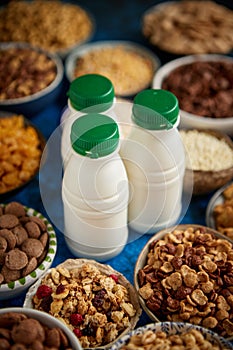 Assortment of different kinds cereals placed in ceramic bowls on table