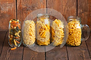 Assortment of different shapes whole grain raw Italian pasta in