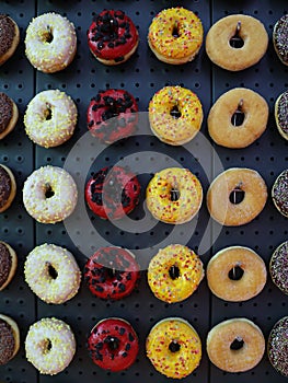 Assortment of donuts with various colors and toppings
