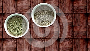 Assortment of dried peas, hemp, flaxe, raisins on wooden table