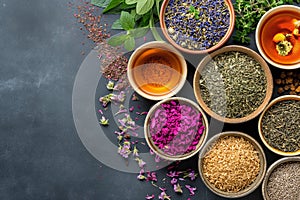 Assortment of dry tea, healing herbs with flowers. The image is generated with the use of an AI.