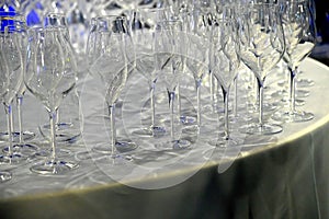 Assortment of empty goblets on table with tablecloth