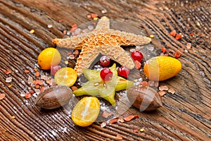 Assortment of exotic fruits, nuts and starfish