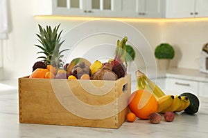 Assortment of exotic fruits on table in kitchen