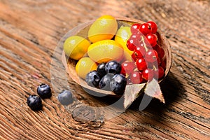 Assortment of exotic fruits on a wooden background