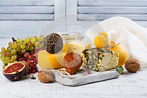 Assortment of farm cheese with supplemental snacks