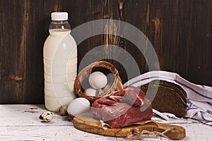 Assortment of farmer products over wooden background