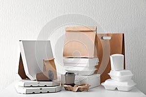 Assortment of food delivery containers on white table