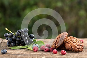 Assortment of fresh baked goods wooden background. baguette and cookies in the open space