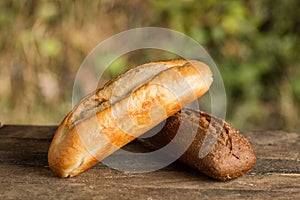 Assortment of fresh baked goods wooden background. baguette and cookies in the open space