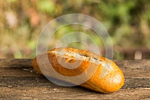 Assortment of fresh baked goods wooden background. baguette and cookies in the open space