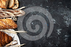 Assortment of fresh bread, baking ingredients. Still life captured from above, banner layout.Healthy homemade bread.
