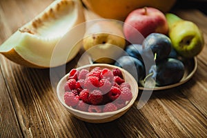 Assortment of fresh fruits and berries. Fruits plum, apple, pear.