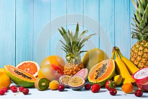 Assortment of fresh fruits and berries on table. Summer healthy eating concept. Still life of food