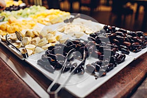 Assortment of fresh fruits displayed in hotel buffet. Variety of tropical exotic food in canteen ready for dinner