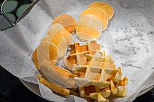 Assortment of fresh pastry on table in buffet .