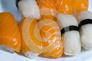 Assortment of fresh sushi, sushi with salmon and butterfish. Tasty fresh japanese cuisine. Asian food. Susi.