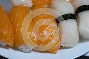 Assortment of fresh sushi, sushi with salmon and butterfish. Tasty fresh japanese cuisine. Asian food. Susi.