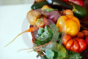 Assortment of fresh vegetables in a basket, bio healthy, organic food on white background